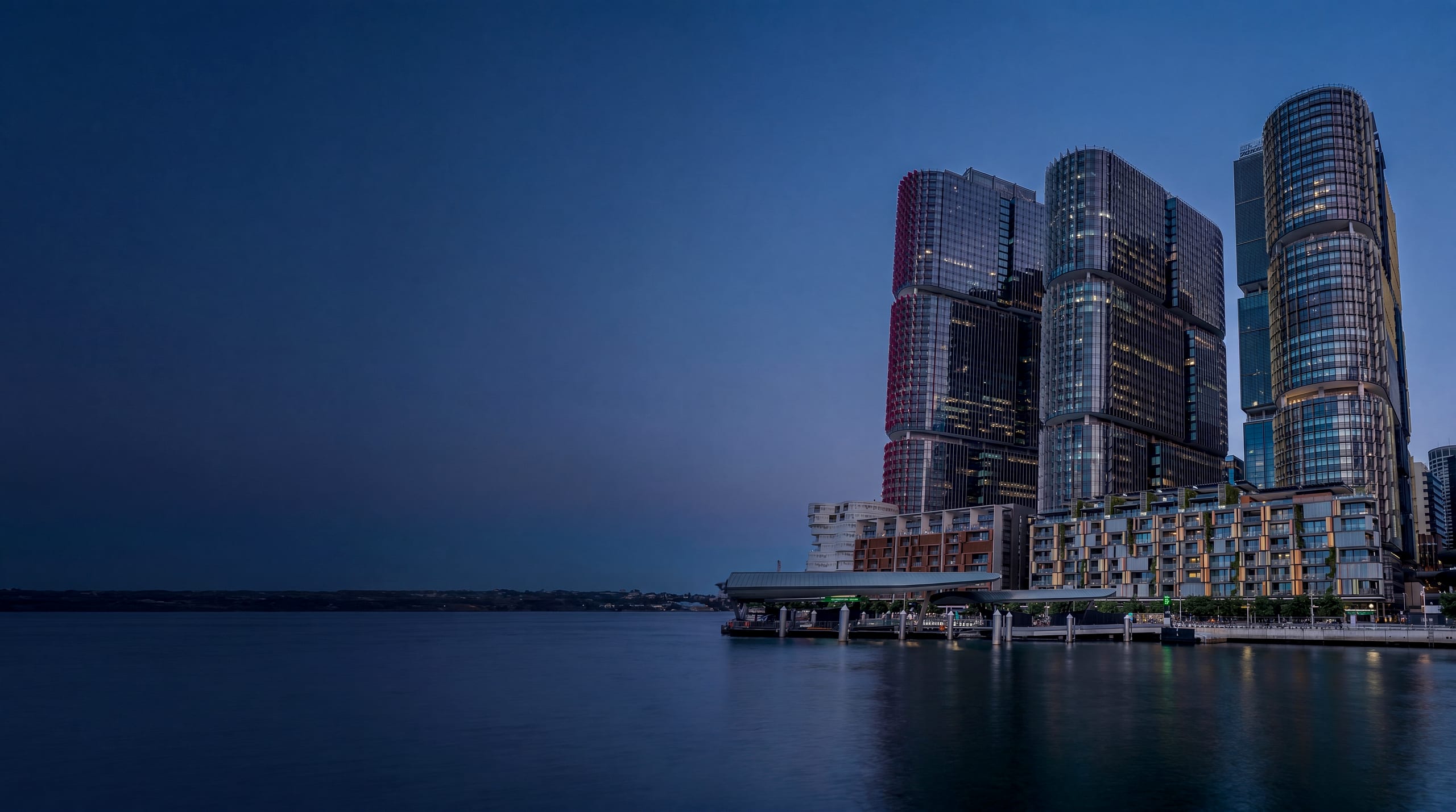 Sydney's Barangaroo towers at dusk — One International Towers, where HMS Group's Sydney office sits
