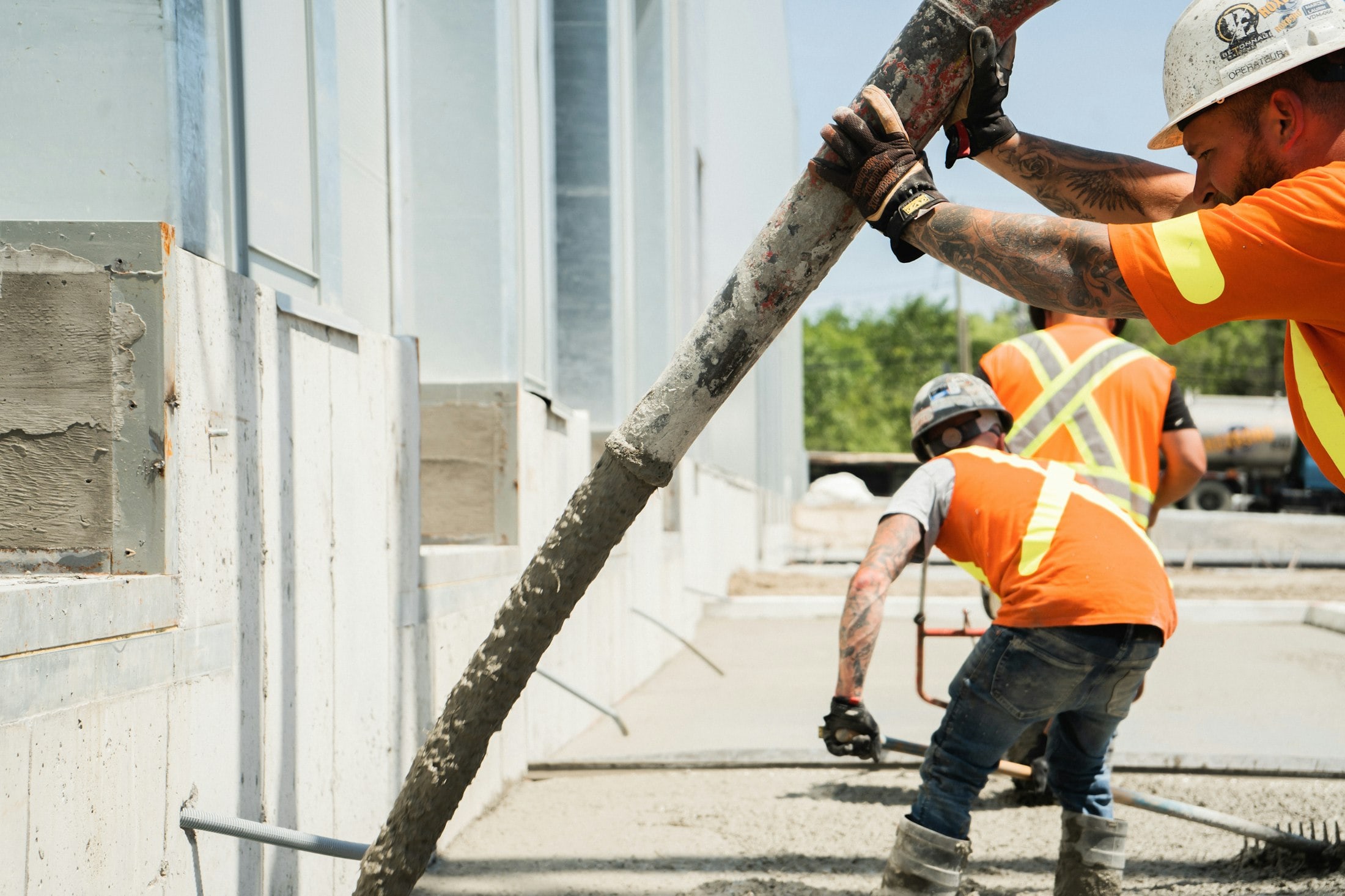 A construction crew placing concrete on a building site